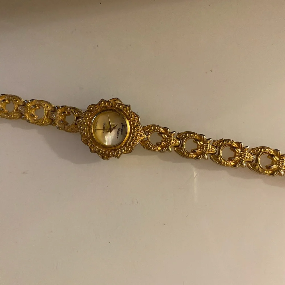 Jacques Couture Quartz movement gold‎ toned watch